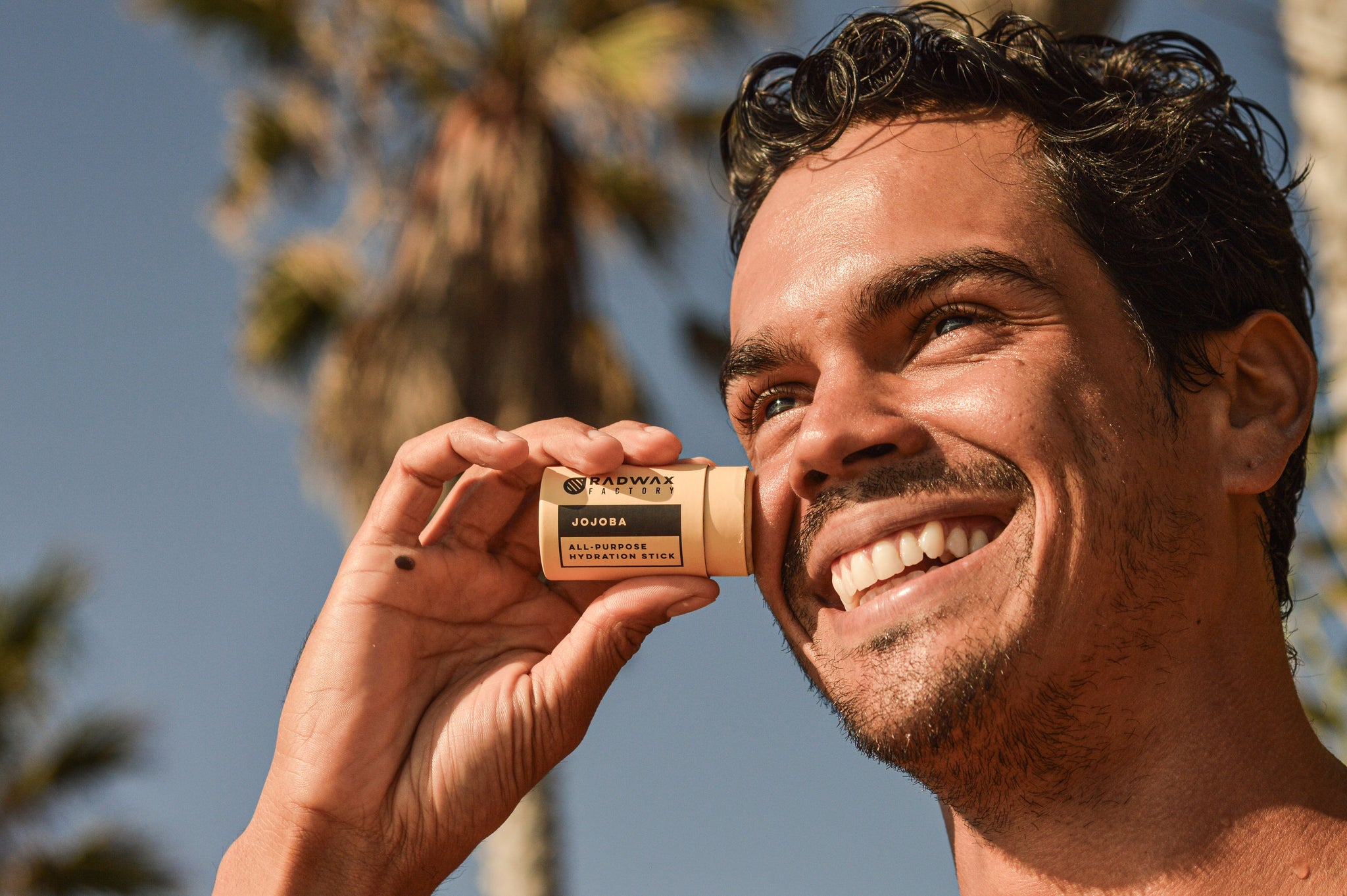 Rad Wax beeswax wellness products in warm sunlight